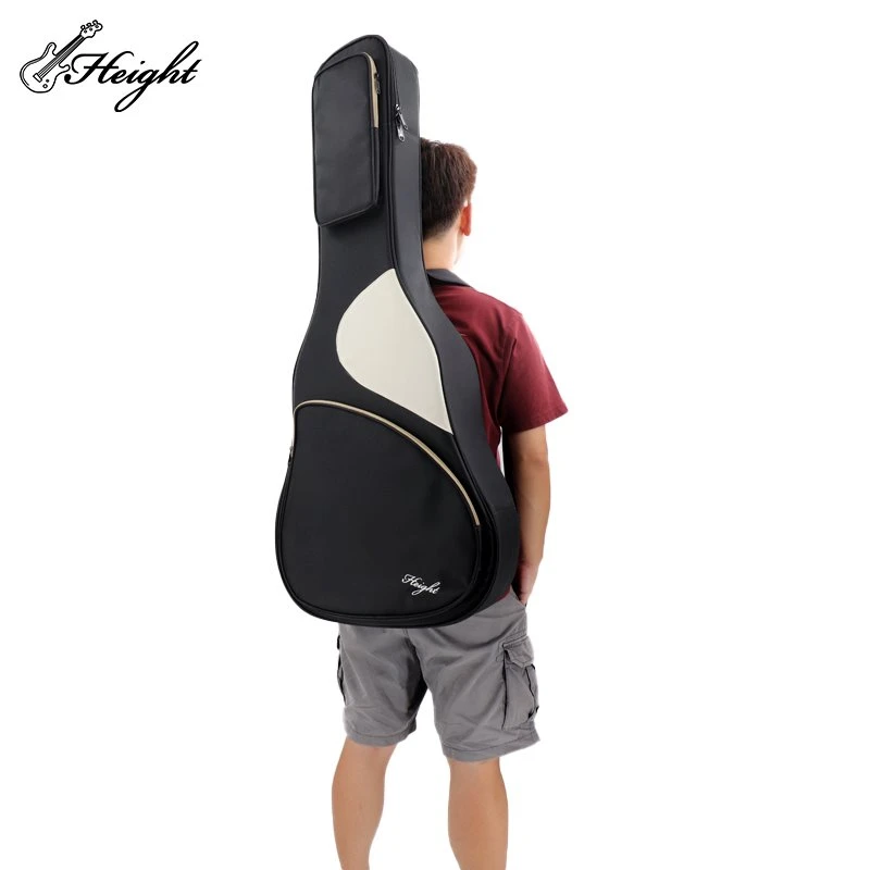 A man carry the black guitar bag in back
